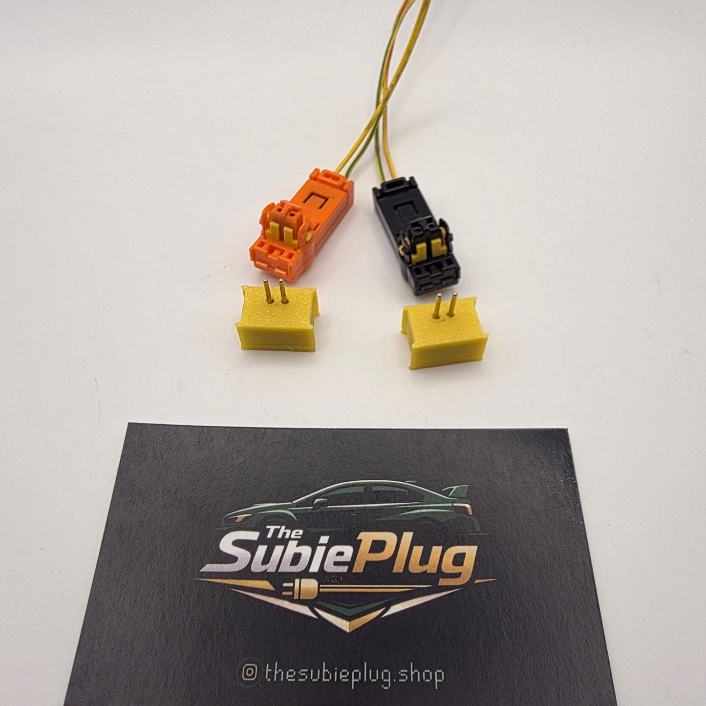 Car plug connectors with a branded card on a white background